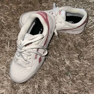Pink and white low top Reebok shoes 7M